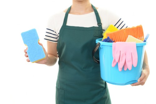 Domestic cleaner tidying a Twickenham kitchen